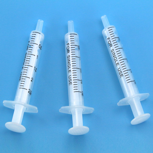 Disposable two piece syringe